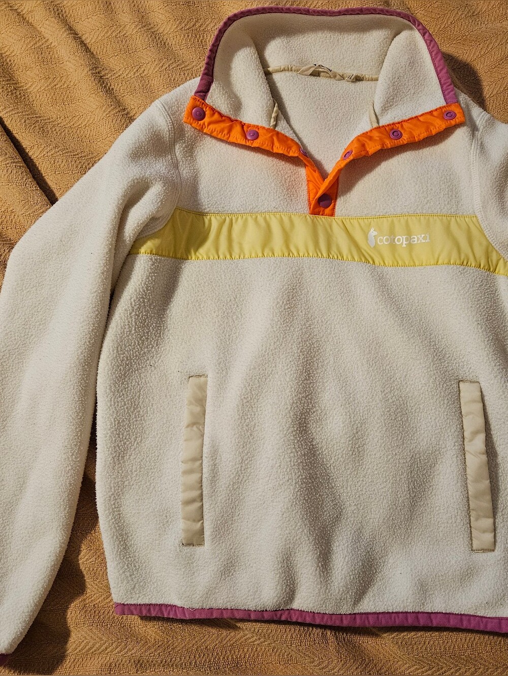 Cotopaxi Cream Fleece Pullover with Yellow, Orange & Purple Trim